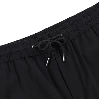 Nuevos productos sueltos los hombres y las mujeres delgadas de tejido de los pantalones cortos de verano de los hombres de micro-elástica casual pantalones de los deportes